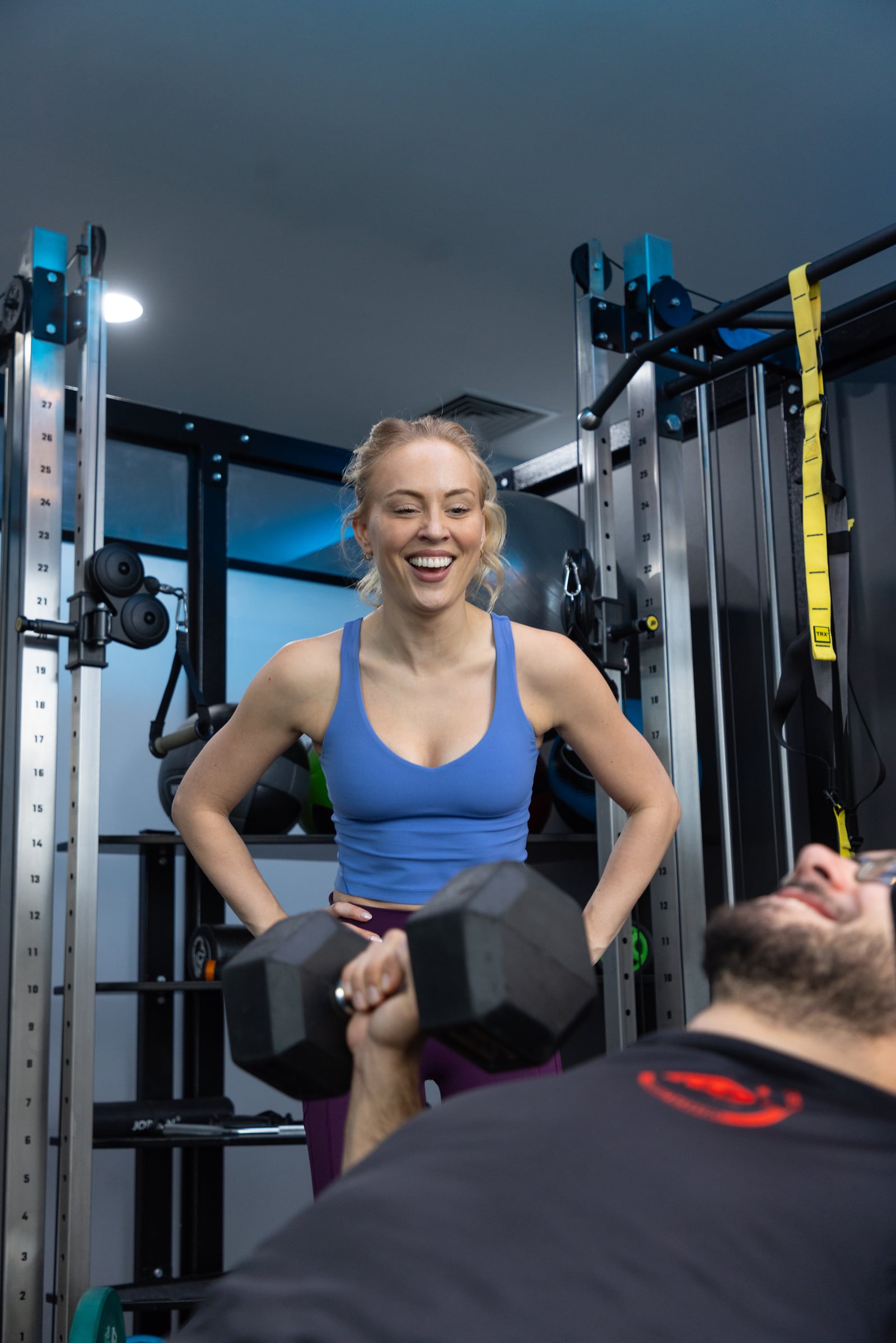 Two members training together with barbells in a private Strength POD at GYMPODS Dalston
