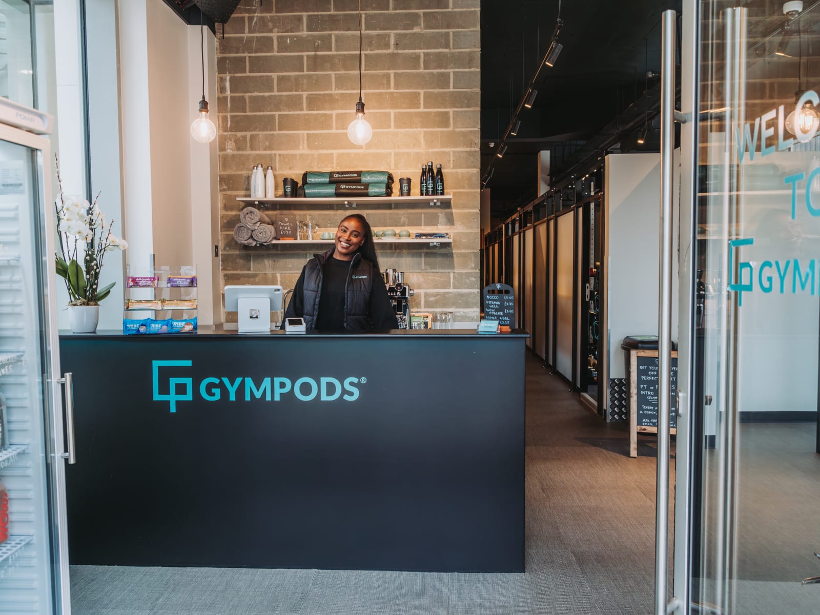 Reception area at GYMPODS Putney with private gym POD bookings counter