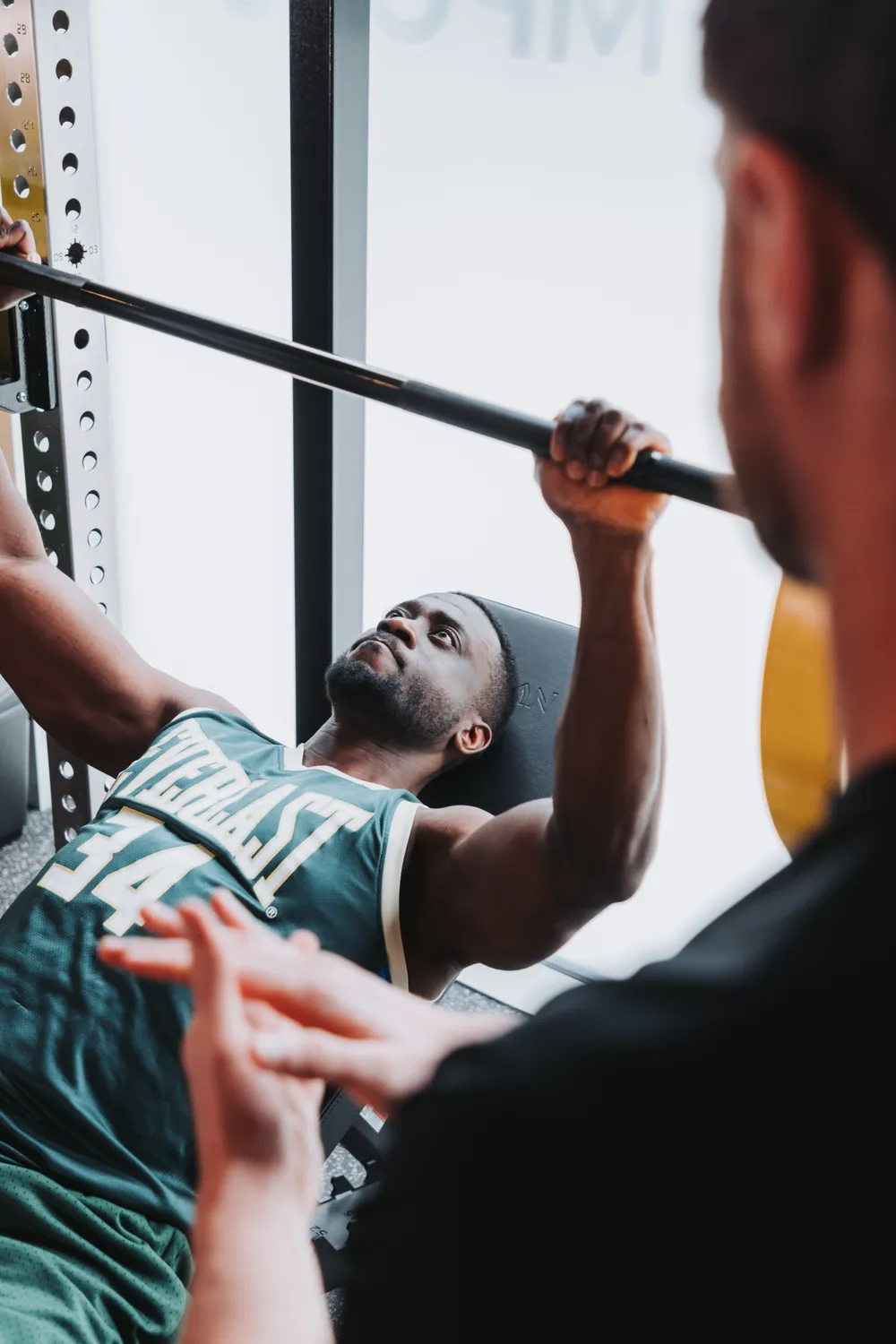 Personal trainer coaching a client in a private Strength POD at GYMPODS Putney