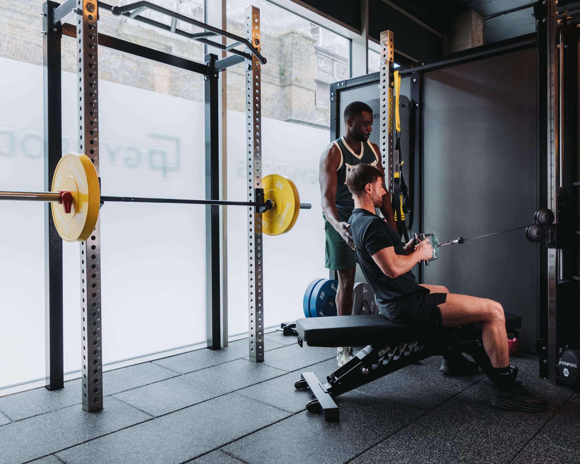 Strength POD at GYMPODS with half rack and dumbbells